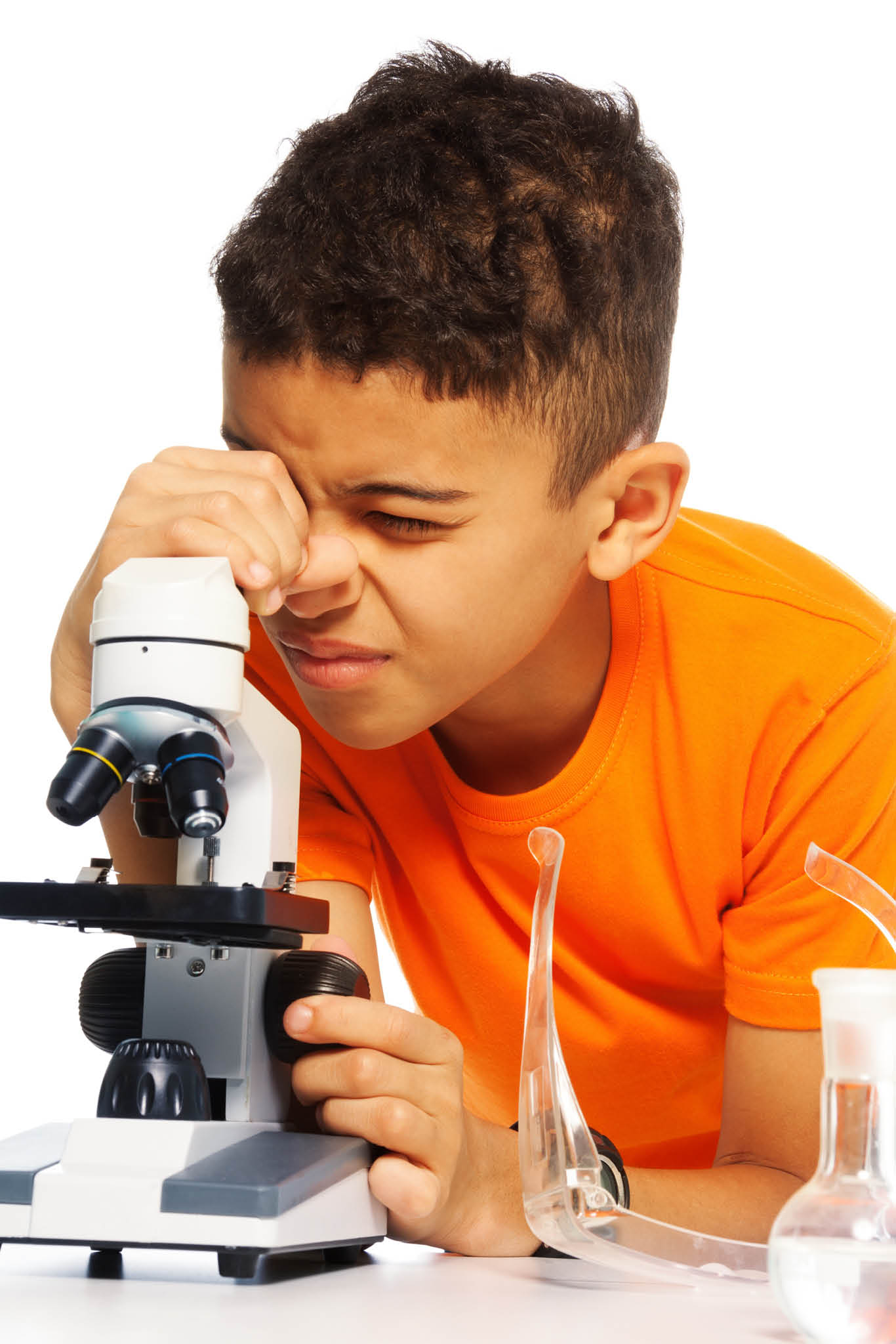 18420715 - black ten years old boy on biology class using microscope